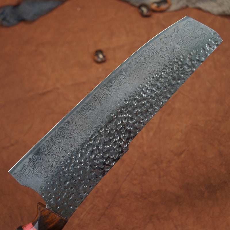 Close up view of the Japanese Nakiri Damascus steel blade showing the patters 