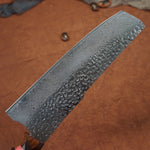 Load image into Gallery viewer, Close up view of the Japanese Nakiri Damascus steel blade showing the patters 
