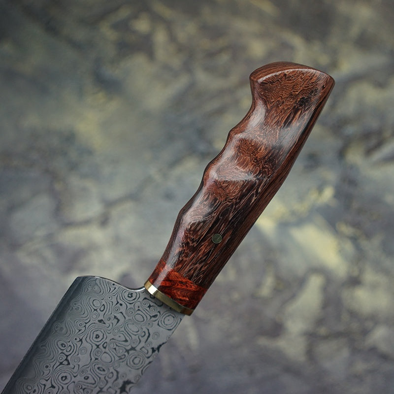 Close up of the Indian acid wood handle. The Japanese Damascus steel chef knife.  