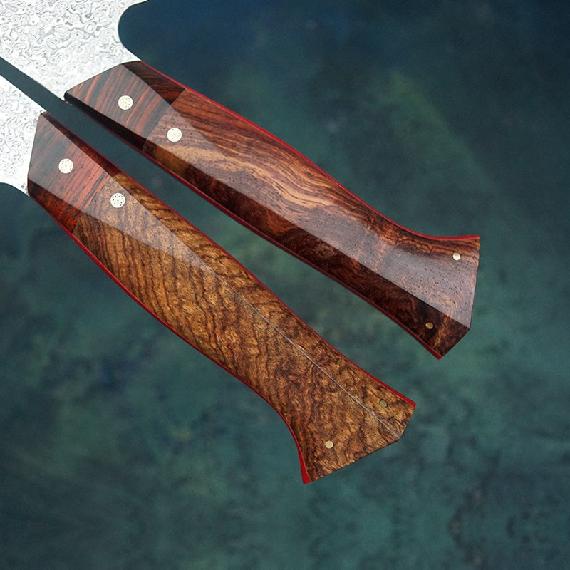 Close up of the handle and shape of the Professional handmade, hand forged 8 inch rosewood handle Damascus steel Japanese kitchen chef knife 
