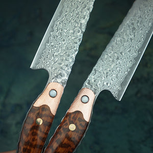 Close up showing the snakewood handle with a copper finishing as well as the Damascus steel patterns on the Chef knife 