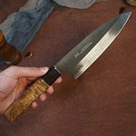 Load image into Gallery viewer, The Japanese Deba knife being held showcasing the gorgeous Burl wood handle  
